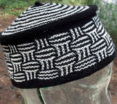 Malabrigo Merino Sock Yarn color black and natural hand-knitted hat/tam