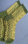 Hand-knit fair isle socks made with Malabrigo Merino Sock Yarn color ochre