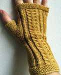 Hand-knit cabled fingerless gloves made with Malabrigo Merino Sock Yarn color ochre