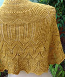 Hand-knit lace shawl/scarf made with Malabrigo Merino Sock Yarn color ochre