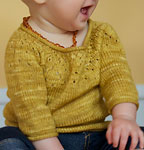 Hand-knit child's pullover sweater made with Malabrigo Merino Sock Yarn color ochre