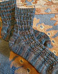 Hand-knit ribbed socks using Malabrigo Merino Sock Yarn color persia