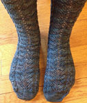 Hand-knit cabled socks using Malabrigo Merino Sock Yarn color persia