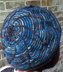 Hand-knit multi-color hat using Malabrigo Merino Sock Yarn color persia