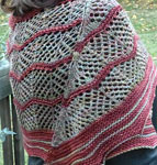 Hand-knit lacey shawl/scarf made with Malabrigo Merino Sock Yarn colors primavera and botticelli red