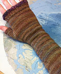 Hand-knit long fingerless mittens made with Malabrigo Merino Sock Yarn colors primavera