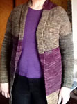 Hand knit long sleeved cardigan with Malabrigo sock yarn rayon vert