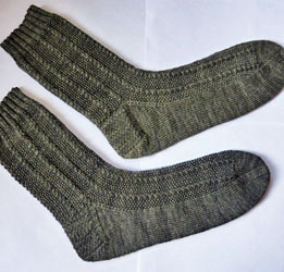 Hand knit socks made with Malabrigo Merino Sock Yarn color alcaucil