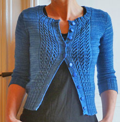 Hand knit short sleeve cabled cardigan sweater knit with Malabrigo Merino Sock Yarn color impressionist sky