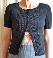 Emelie short sleeve cabled cardigan sweater knit with Malabrigo Merino Sock Yarn color black