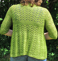 Hand knit short sleeve open front cardigan sweater knit with Malabrigo Merino Sock Yarn color lettuce