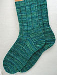 Hand-knit ribbed socks knit with Malabrigo Merino Sock Yarn color solis