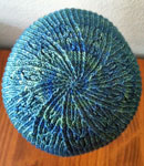 Hand-knit hat/cap knit with Malabrigo Merino Sock Yarn color solis