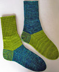 Hand-knit two-color socks knit with Malabrigo Merino Sock Yarn colors solis and lettuce