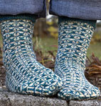 Hand-knit fair isle socks knit with Malabrigo Merino Sock Yarn colors solis and natural