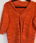Malabrigo Sock Yarn color terracotta knit short sleeve cardigan