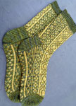 Hand knit fair isle socks knit with Malabrigo Merino Sock Yarn color turner and ochre
