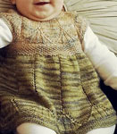 Hand knit baby sweater dress knit with Malabrigo Merino Sock Yarn color turner