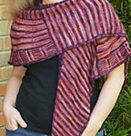 Rockefeller shawl/wrap by Stephen West with velvet grapes and archangel