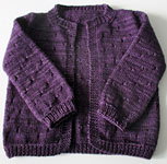 hand knit child's open front cardigan with Malabrigo sock yarn color violeta africana