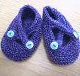 hand knit baby booties with Malabrigo sock yarn color violeta africana